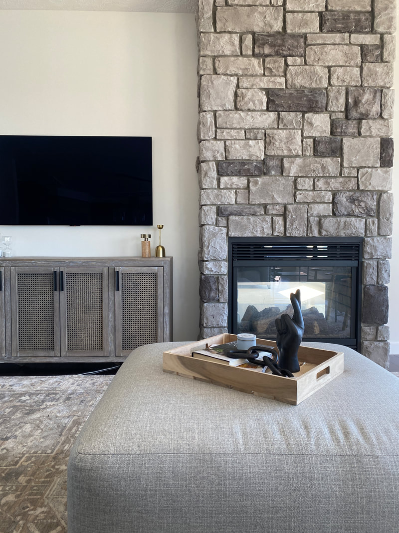 Living room décor, stone fireplace, sectional, lake house, Vernon BC interior design, interior designer, Alyssa Wilcox Interiors